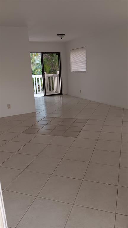 4169 Southwest 67th Avenue, Unit 209A Davie, FL 33314 - Photo 4 of 18 a view of livingroom with furniture and window