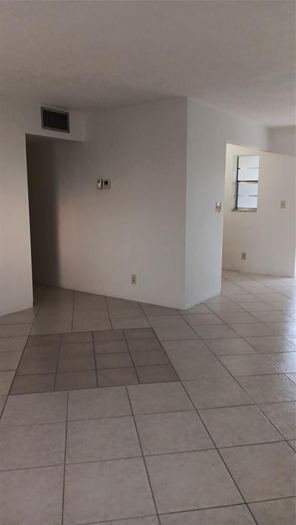4169 Southwest 67th Avenue, Unit 209A Davie, FL 33314 - Photo 5 of 18 a view of an empty room and window