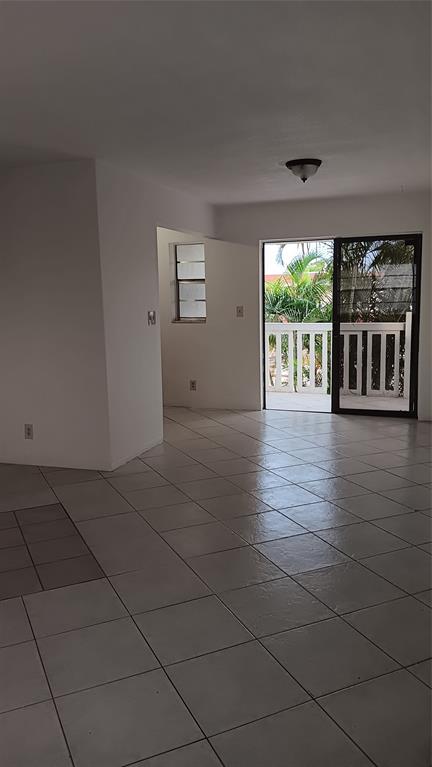 4169 Southwest 67th Avenue, Unit 209A Davie, FL 33314 - Photo 6 of 18 a view of an empty room with a window