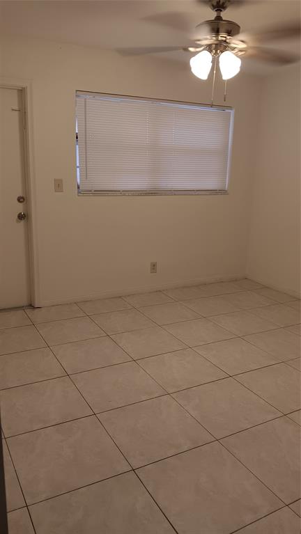4169 Southwest 67th Avenue, Unit 209A Davie, FL 33314 - Photo 10 of 18 a view of an empty room with a chandelier fan