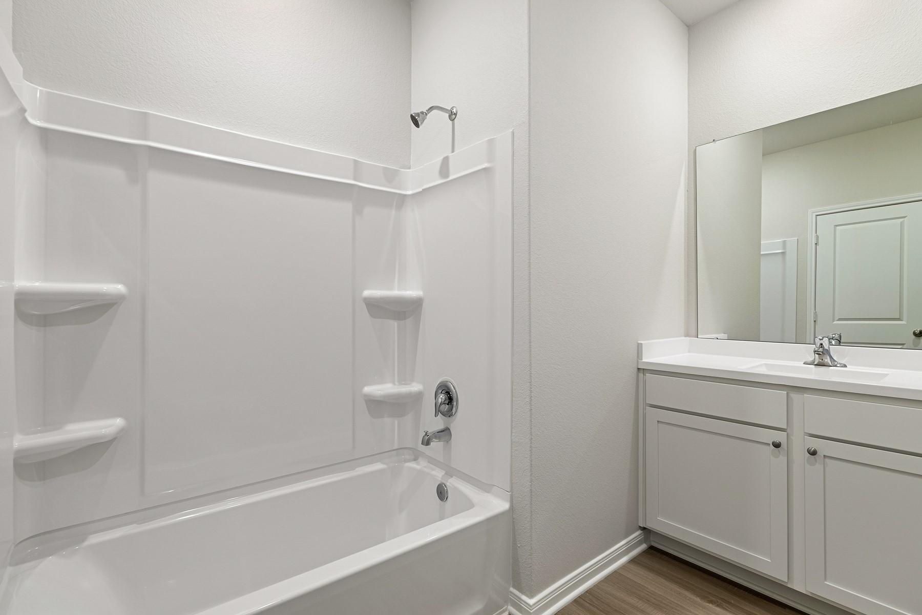 345 Fastboy Lane Waller, TX 77484 - Photo 19 of 21 a bathroom with a bathtub and a sink