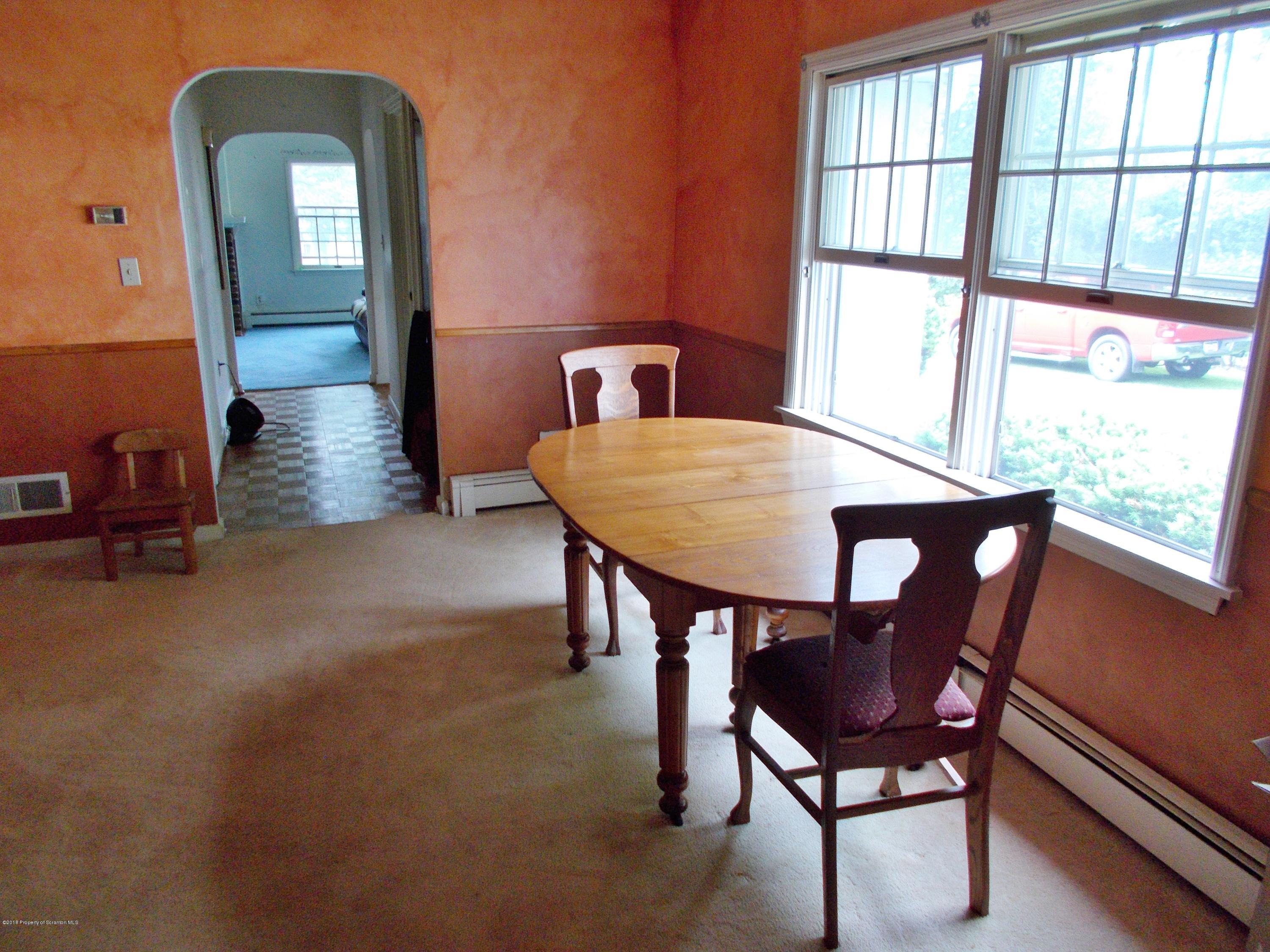 577 Pa-rt690 Road Moscow, PA 18444 - Photo 3 of 16 a view of a dining room with furniture and a window