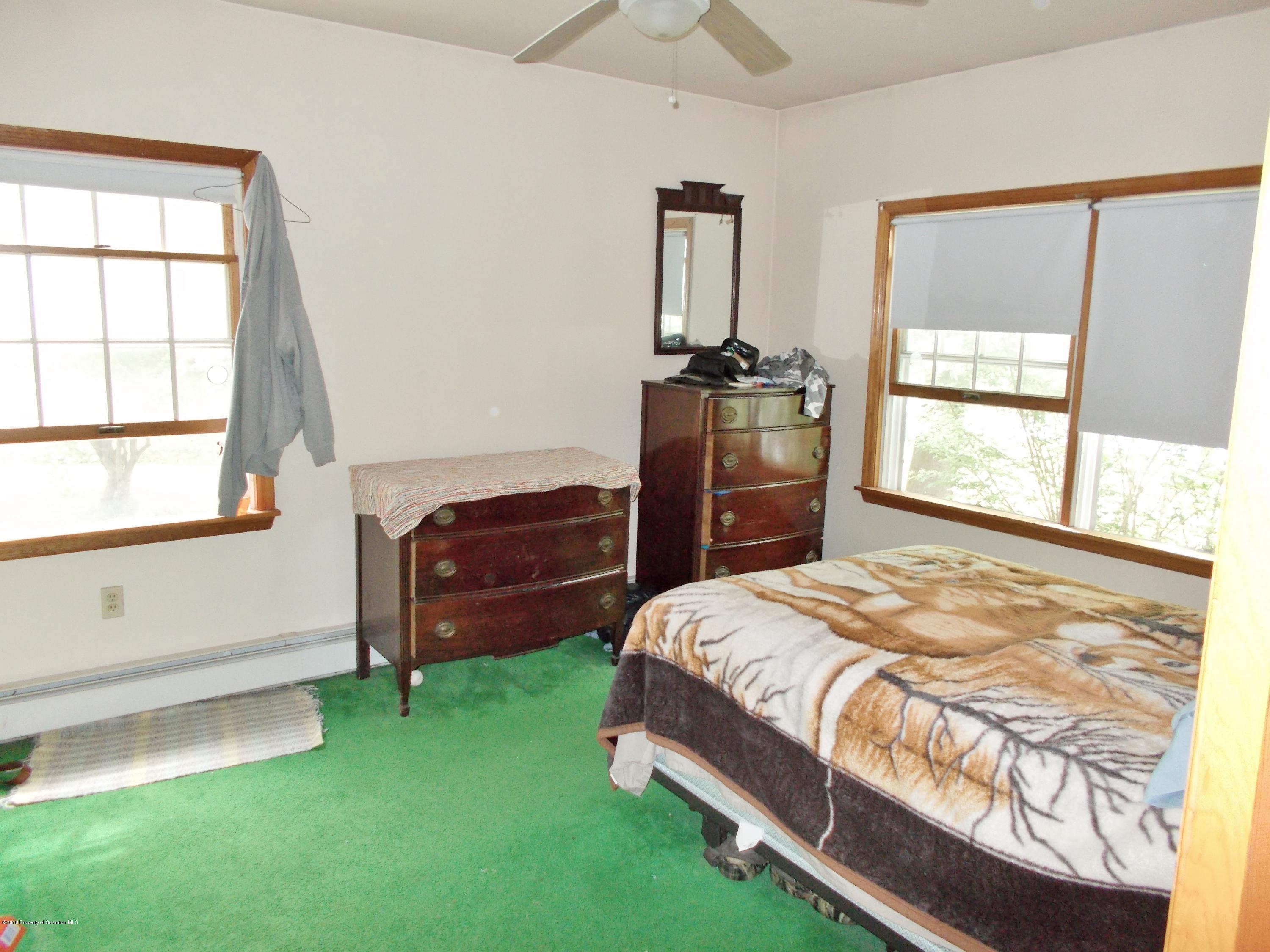 577 Pa-rt690 Road Moscow, PA 18444 - Photo 10 of 16 a bedroom with a bed and a window