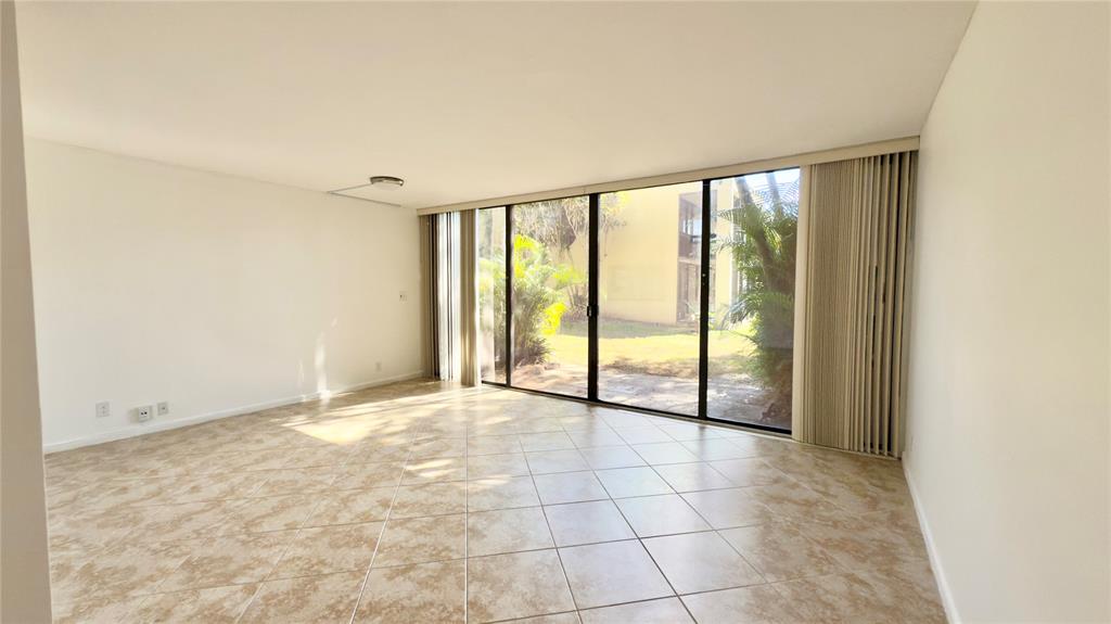 2941 Southwest 87th Avenue, Unit 403 Davie, FL 33328 - Photo 12 of 24 a view of an empty room and window