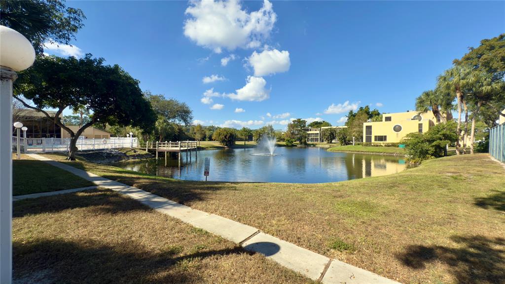 2941 Southwest 87th Avenue, Unit 403 Davie, FL 33328 - Photo 18 of 24 a view of a lake with houses