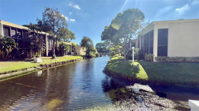 a view of a water fountain in front of a house