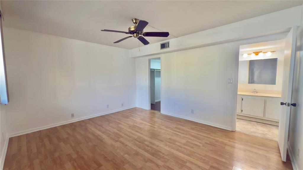 2941 Southwest 87th Avenue, Unit 403 Davie, FL 33328 - Photo 3 of 24 a view of empty room with wooden floor and ceiling fan