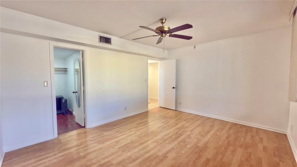 2941 Southwest 87th Avenue, Unit 403 Davie, FL 33328 - Photo 4 of 24 a view of a room with wooden floor and white walls