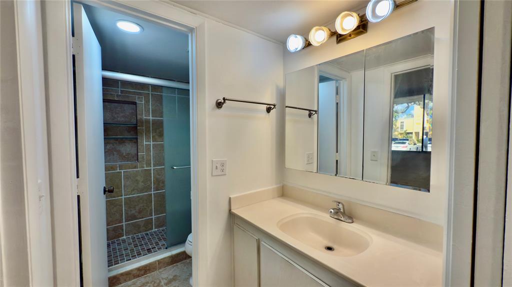 2941 Southwest 87th Avenue, Unit 403 Davie, FL 33328 - Photo 5 of 24 a bathroom with a sink vanity and a mirror