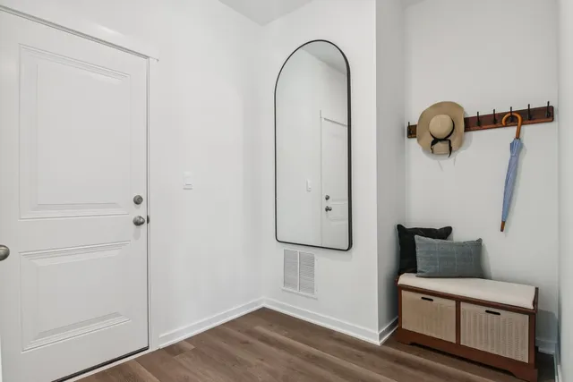 a view of entryway with wooden floor