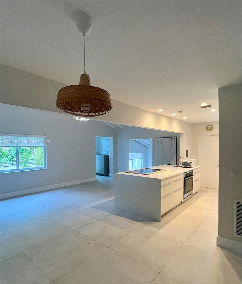 337 Southwest 23rd Road Miami, FL 33129 - Photo 13 of 30 a living room with stainless steel appliances granite countertop furniture and a kitchen view