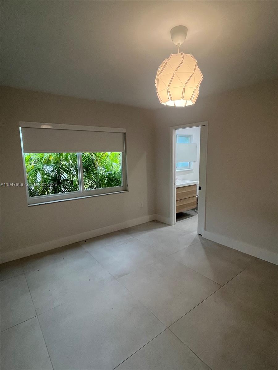 337 Southwest 23rd Road Miami, FL 33129 - Photo 21 of 30 an empty room with window mirror and windows