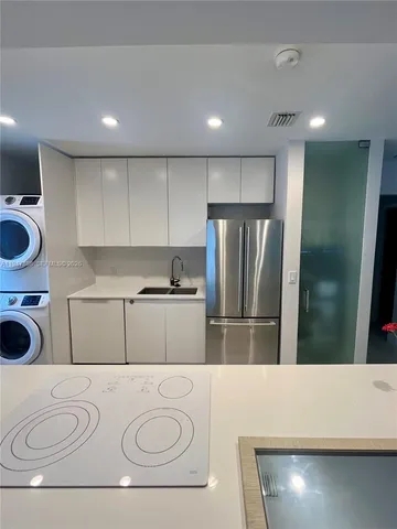 a stove top oven sitting inside of a kitchen