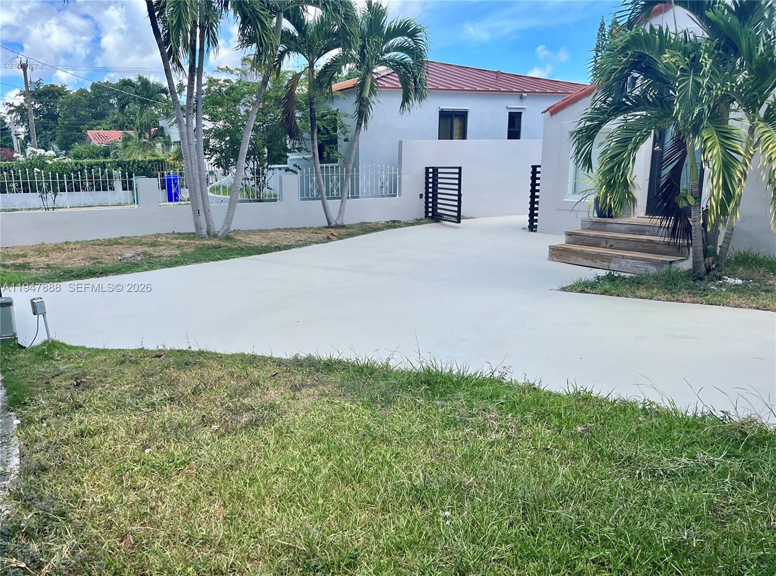 337 Southwest 23rd Road Miami, FL 33129 - Photo 3 of 30 a house with palm tree in front of it