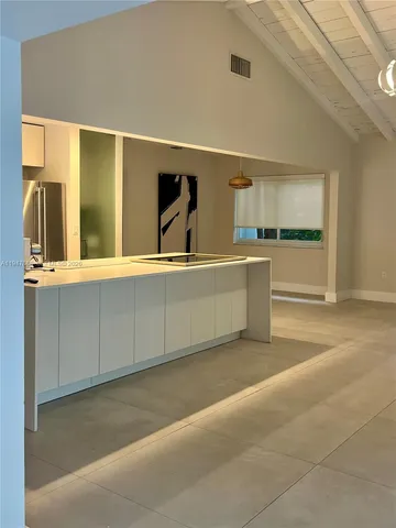 a view of a kitchen with a sink