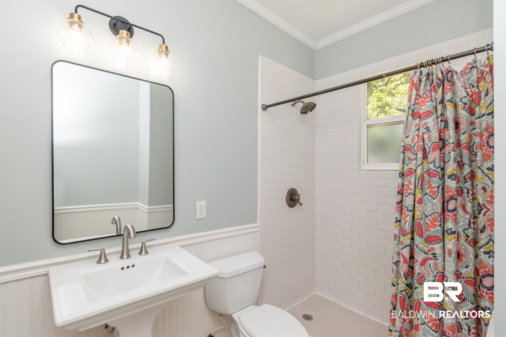 10 Macy Place Mobile, AL 36604 - Photo 22 of 43 Bathroom featuring wainscoting, crown molding, and a shower stall
