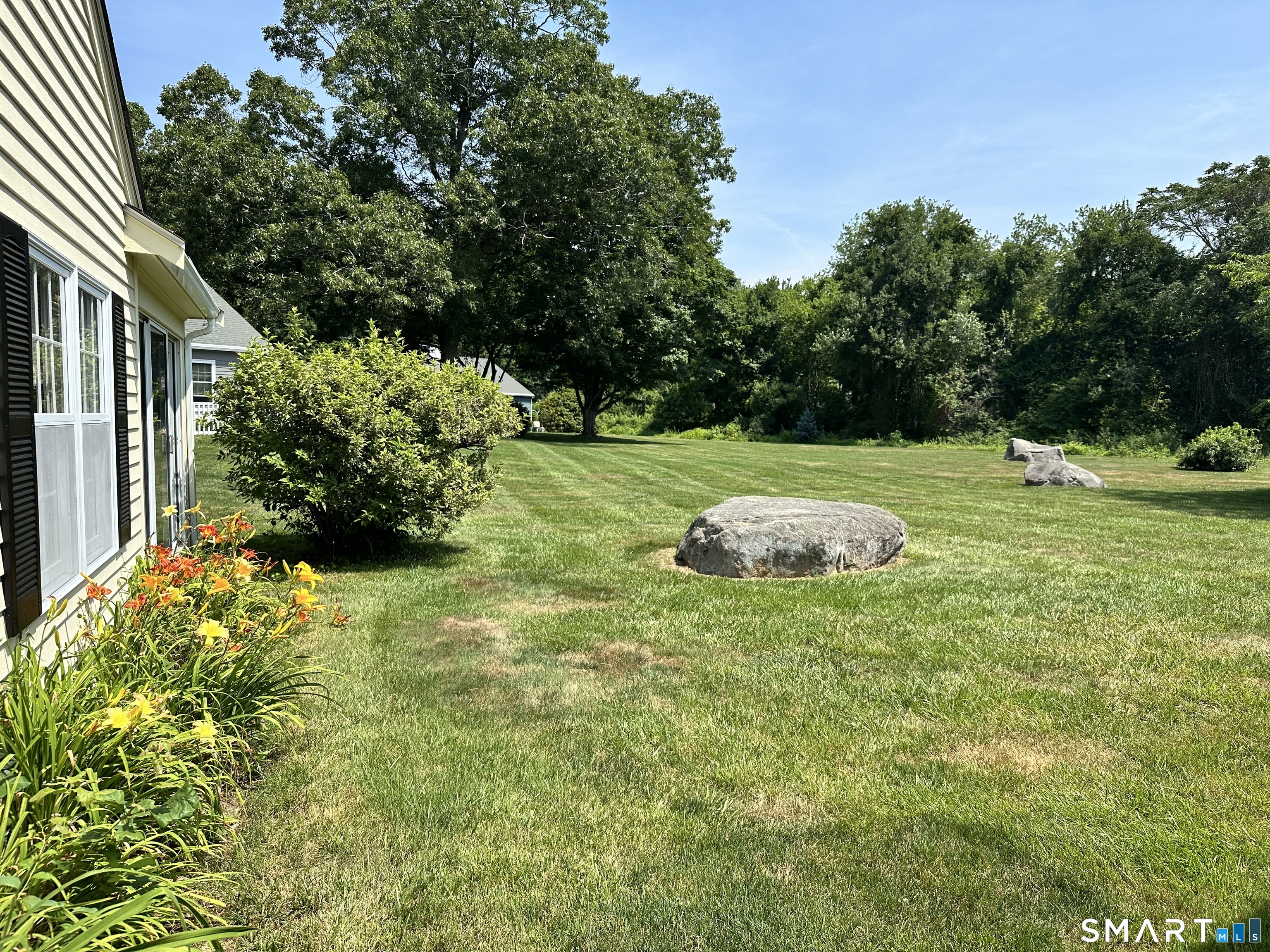 29 Wilshire Road, Unit 29 Madison, CT 06443 - Photo 3 of 6 Bordered with daylilies, this unit is quite light & bright