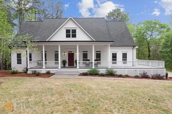 a living room with fireplace furniture and a flat screen tv