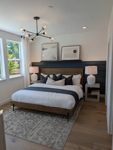 a bedroom with a bed and window