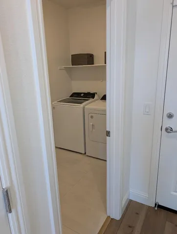 a white refrigerator freezer sitting inside of a kitchen