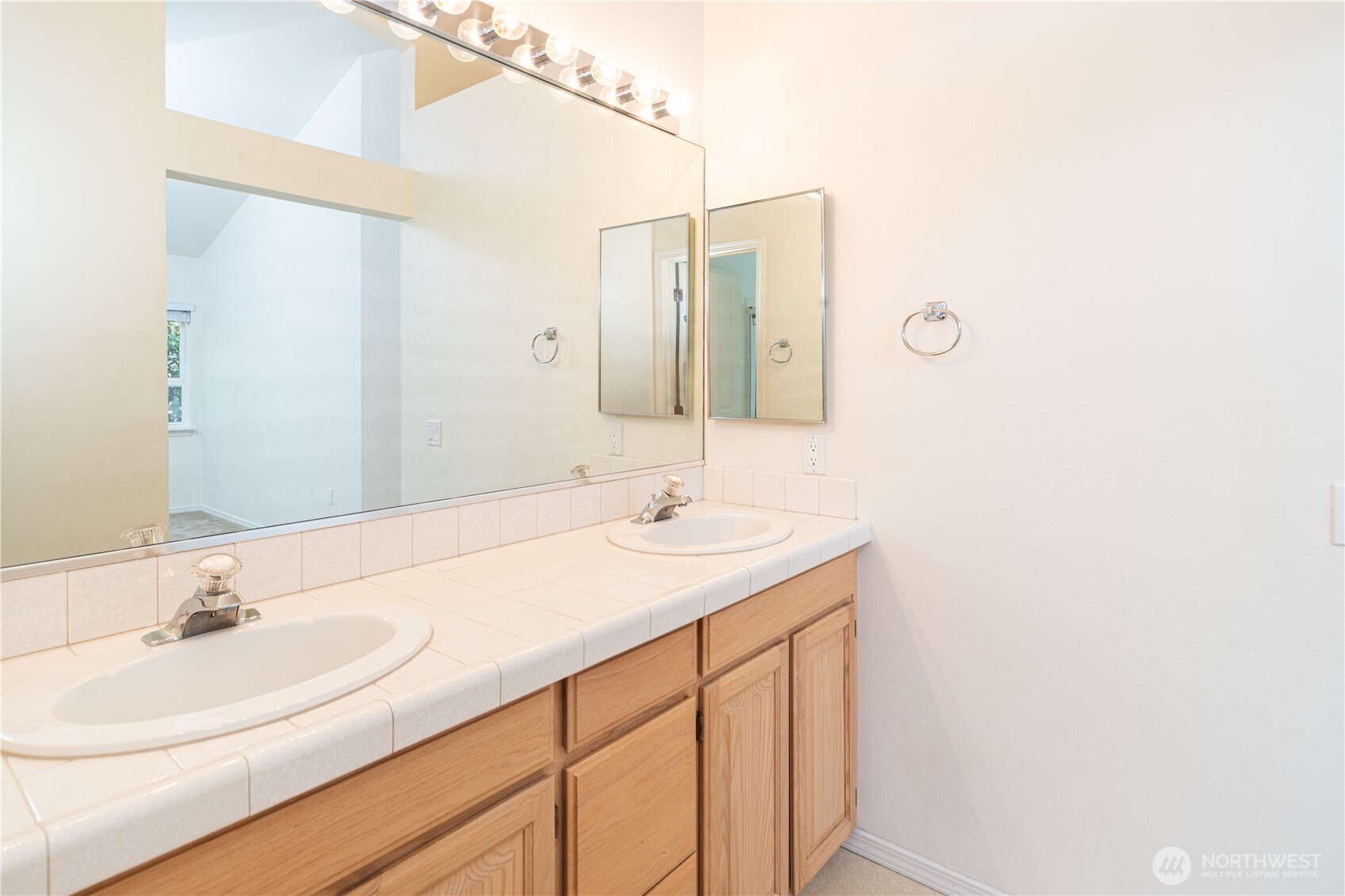 61 South Keel Way Port Ludlow, WA 98365 - Photo 14 of 33 a bathroom with a sink and a mirror