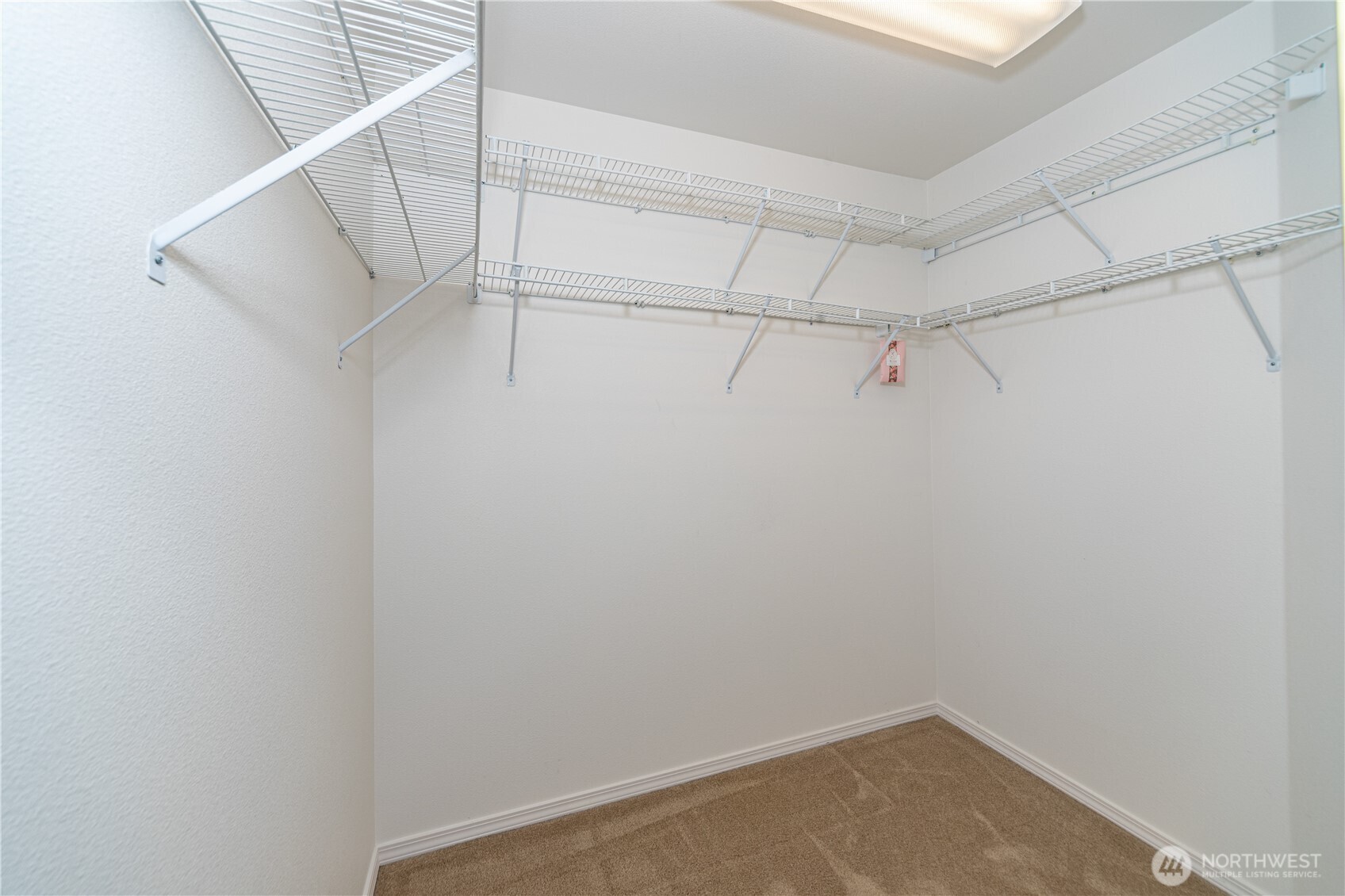 61 South Keel Way Port Ludlow, WA 98365 - Photo 16 of 33 a view of a room with racks on the wall