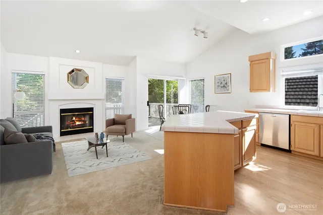 a living room with furniture a window and a fireplace