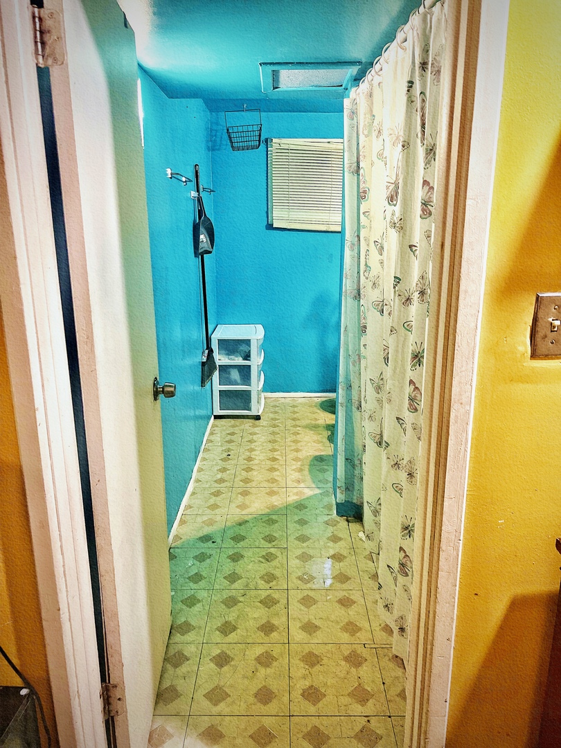 910 Bowling Green Drive Homewood, IL 60430 - Photo 11 of 14 a bathroom with a sink a toilet a mirror and shower