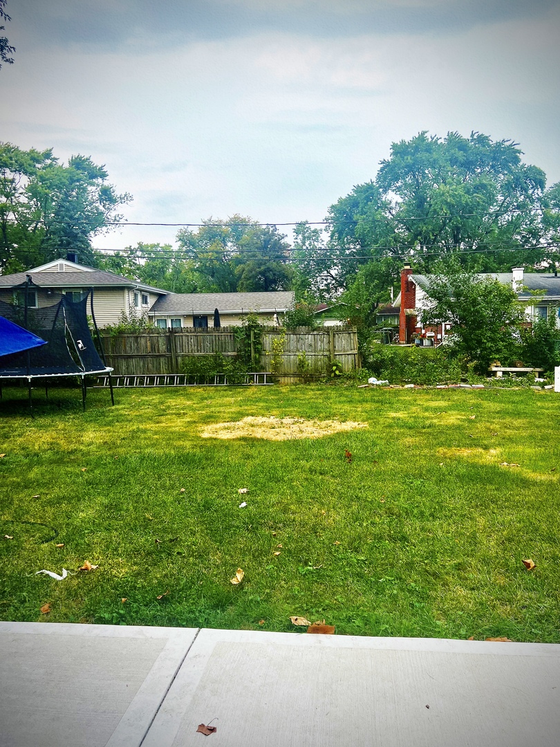 910 Bowling Green Drive Homewood, IL 60430 - Photo 13 of 14 a aerial view of a house with swimming pool garden and patio