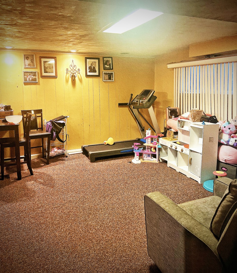910 Bowling Green Drive Homewood, IL 60430 - Photo 10 of 14 a view of a livingroom with furniture and a window