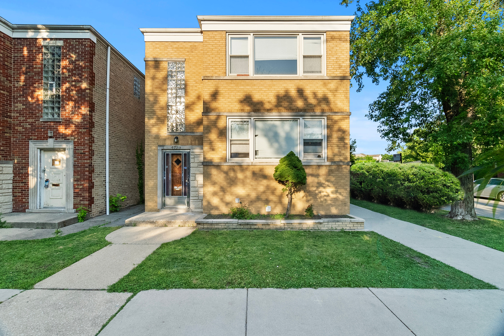 front view of a house with a yard