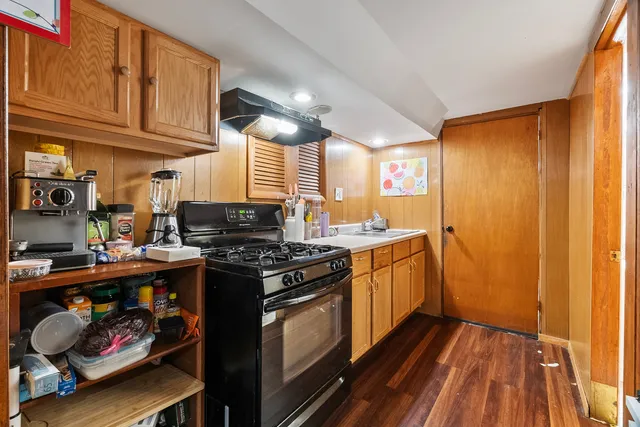a kitchen with stainless steel appliances granite countertop a stove and a refrigerator