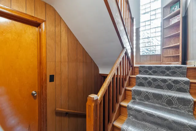 a view of entryway with wooden floor and stairs