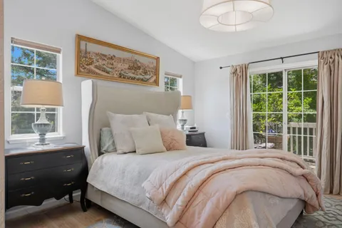 a bedroom with a bed and a table