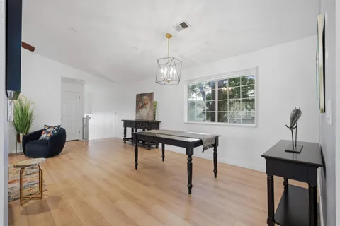 a view of a livingroom with furniture and a window