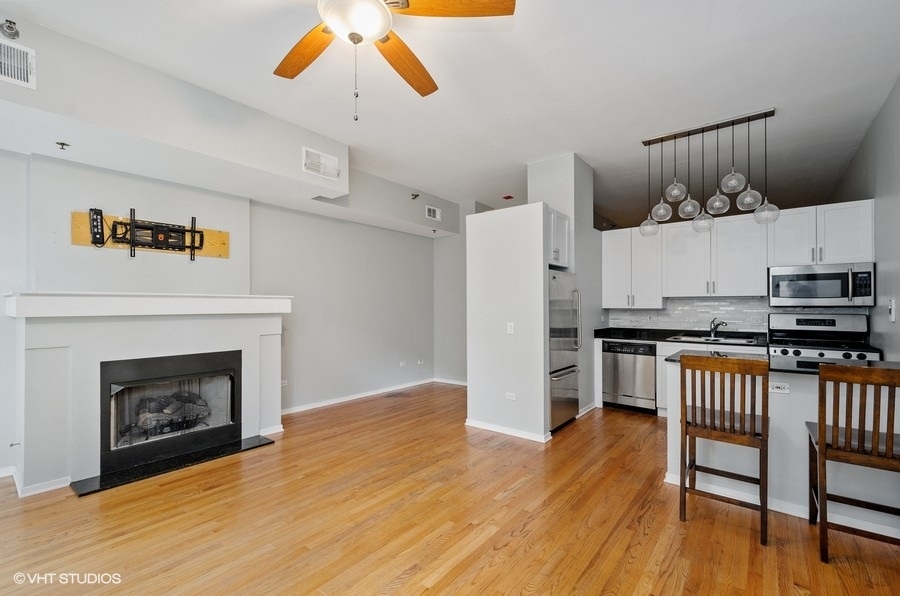 1201 West Adams Street, Unit 609 Chicago, IL 60607 - Photo 3 of 13 a view of a kitchen and an empty room