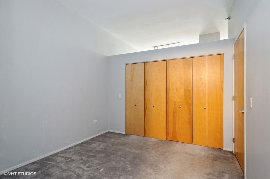 1201 West Adams Street, Unit 609 Chicago, IL 60607 - Photo 8 of 13 a view of an empty room with a window