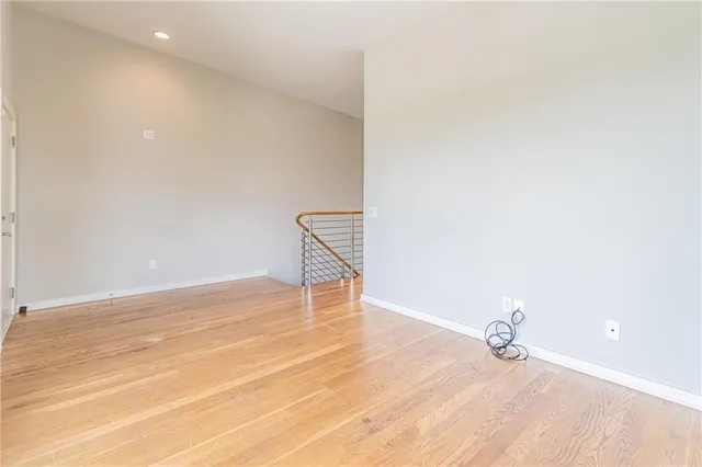 a view of a room with wooden floor