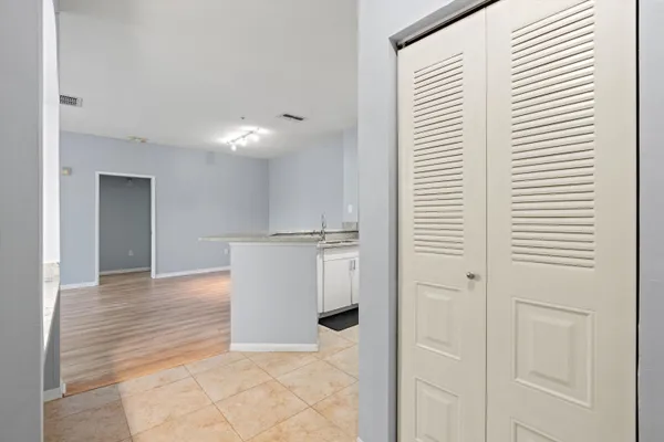 a view of a kitchen from the hallway