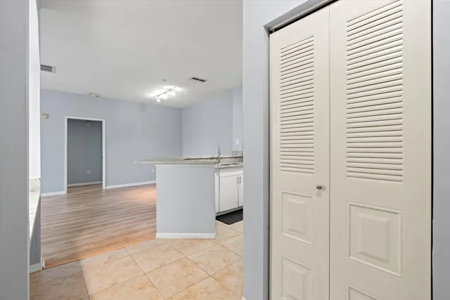 a view of a kitchen from the hallway