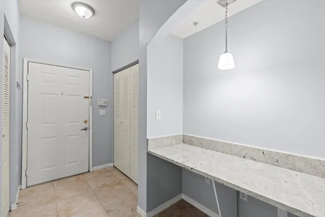 an empty room with wooden floor