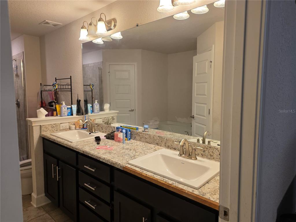 9 Cedar Run Ocala, FL 34472 - Photo 7 of 15 a bathroom with a double vanity sink and a mirror