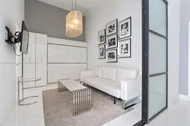 a living room with furniture and a painting