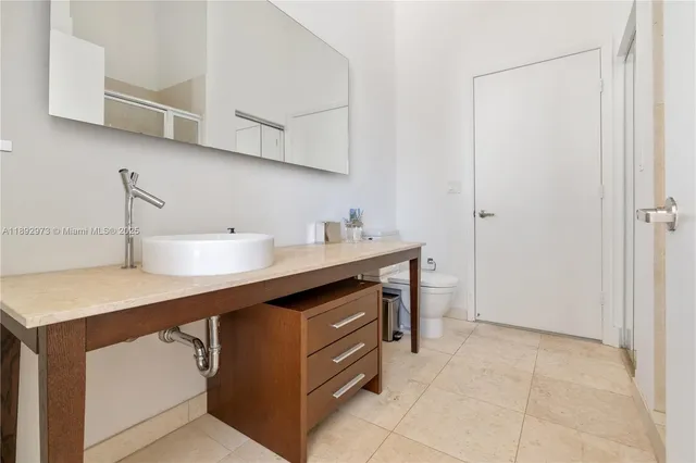 a kitchen with a sink cabinets and appliances