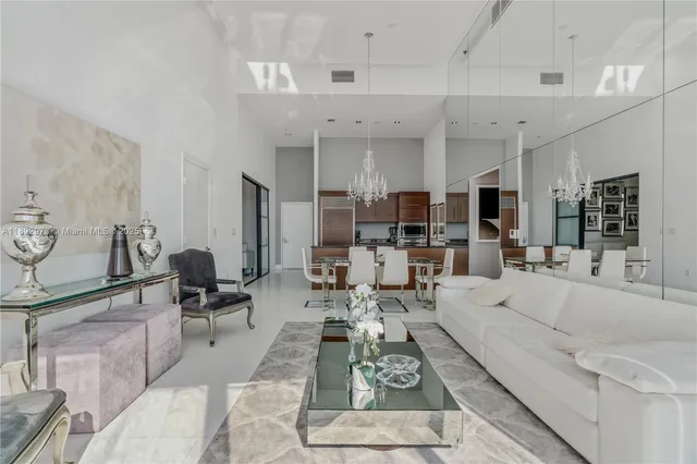 a large white living room with furniture