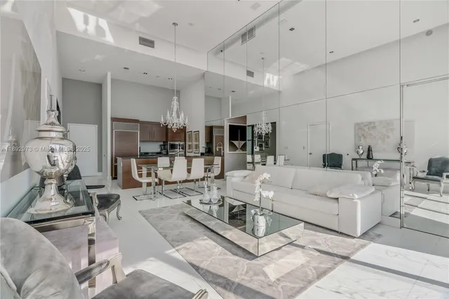 a living room with furniture and white walls