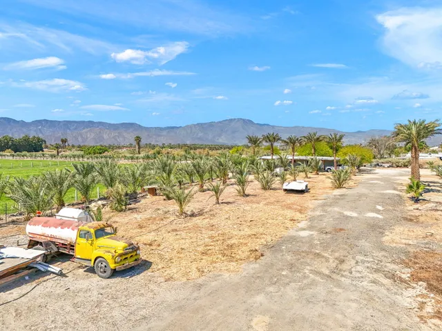 a view of a swimming pool with a table and chairs