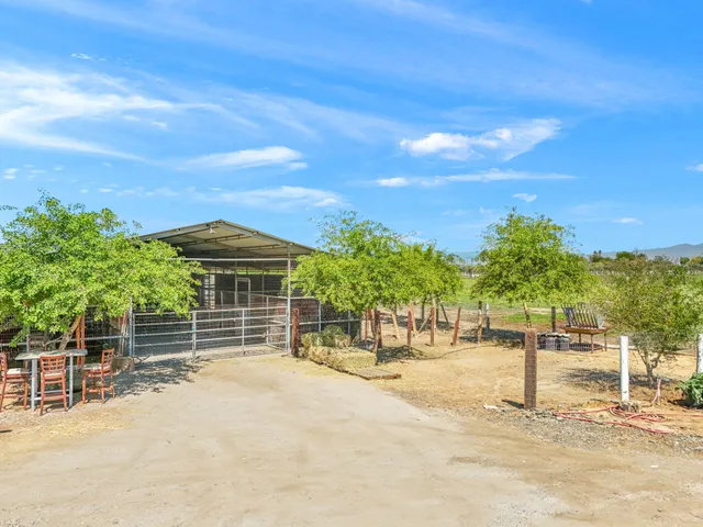 a view of a chairs and table in the patio