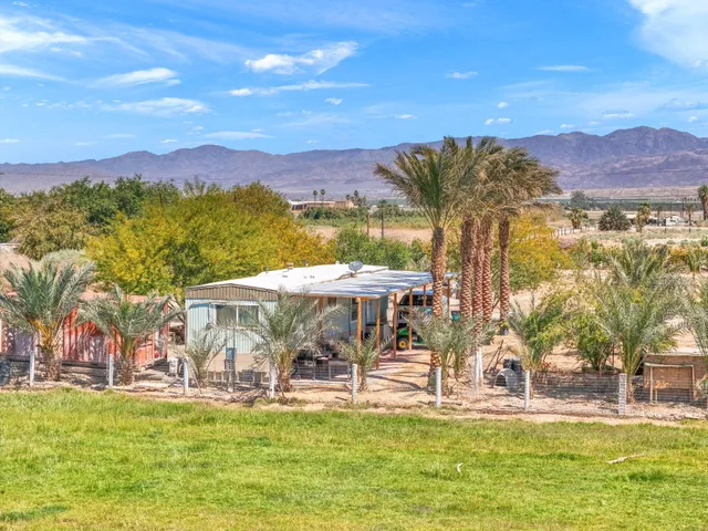 a view of a swimming pool with a mountain in the background