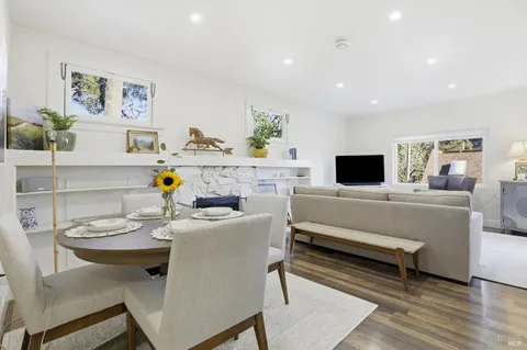 a view of a livingroom with furniture and a fireplace